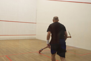 Playing squash in the court