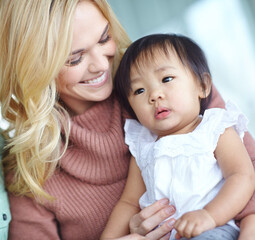 Woman, Asian baby and smile in home for adopted family or bonding, together for wellness with support. Female person, Japanese child and happiness in house with care or love, parenting with relax
