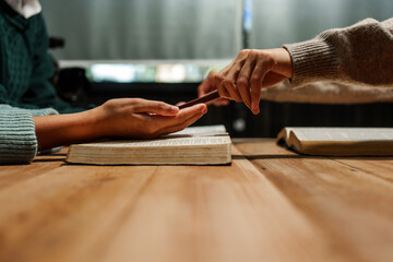 A person reads the Bible, embodying faith and spirituality. The scene reflects a serene moment of contemplation and devotion, highlighting the importance of religion in everyday life.