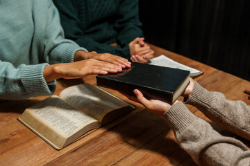 A person reads the Bible, embodying faith and spirituality. The scene reflects a serene moment of contemplation and devotion, highlighting the importance of religion in everyday life.