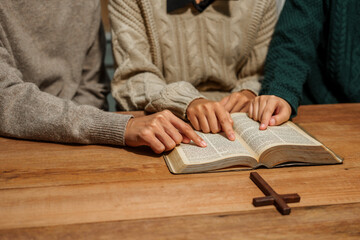 A person reads the Bible, embodying faith and spirituality. The scene reflects a serene moment of contemplation and devotion, highlighting the importance of religion in everyday life.