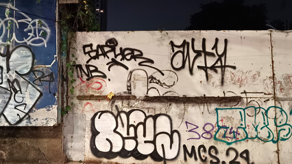 Walls covered in graffiti in the city of Jakarta