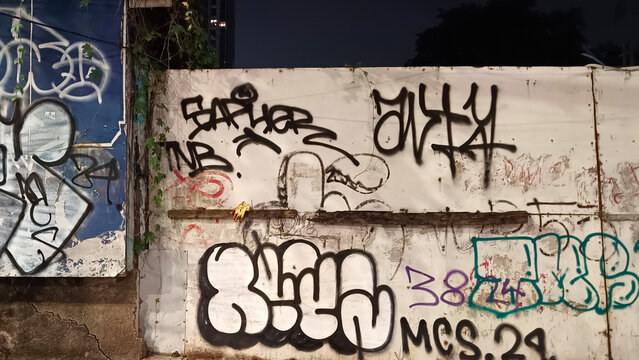 Walls covered in graffiti in the city of Jakarta