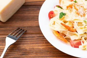 Italian pasta with shrimps , parmesan and tomatoes