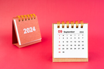 2024 September Mini Calendar On Red Background.