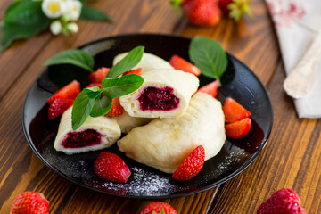 cooked sweet homemade steamed dumplings with strawberries