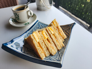 Kaya toasts butter and black coffee is a traditional oriental and vintage Kopitiam breakfast style. Popular in Malaysian and Singaporean