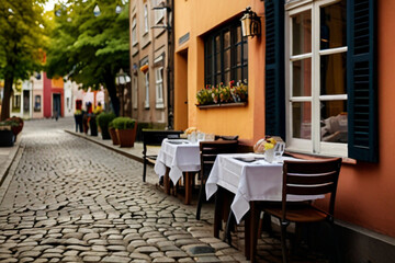 Charming cobblestone streets, historic buildings, and colorful facades creating a picturesque and quaint atmosphere.