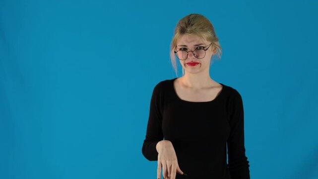 Joyful model uses gestures to repeat companion speech with other hand held over ear. Woman expresses disinterest by mimicing words slow motion