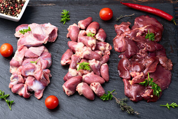 Raw chicken giblets raw poultry meat set : liver, stomach and heart