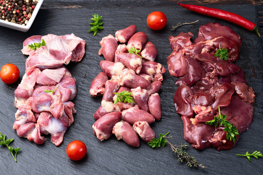 Raw chicken giblets raw poultry meat set : liver, stomach and heart