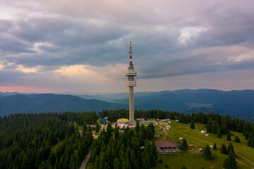 Obraz premium Pamporovo, Bulgaria 24/7/2020 Drone photo of Snejanka peak during sunset 