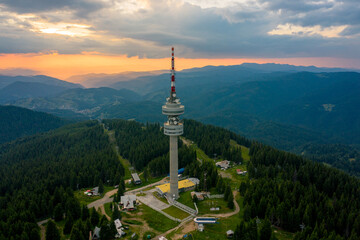 Obraz premium Pamporovo, Bulgaria 24/7/2020 Drone photo of Snejanka peak during sunset 