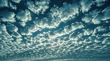 Obraz premium Altocumulus clouds in a blue sky with empty space in the frame