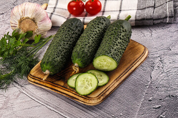 Raw green cucumbers with slices
