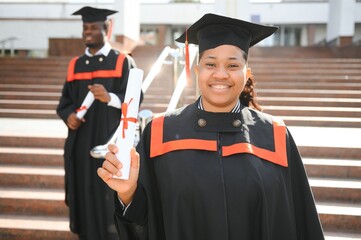 pretty african female college graduate at graduation
