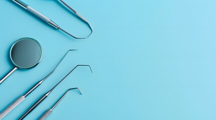 Fototapeta premium Tooth and dental instruments on blue background. Dental treatment. Dentist tools mirror, hook, tweezers, syringe. Copy space for text. 
