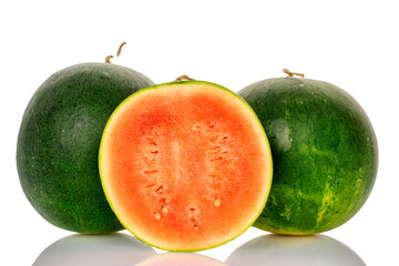 One half of sweet watermelon and two whole, isolated on white background.