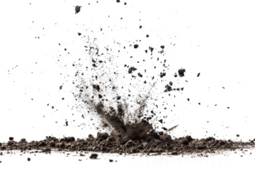 Scattered soil particles forming a starburst pattern in mid-air, set against a white backdrop