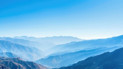 The mountains are covered in a blue mist, creating a serene