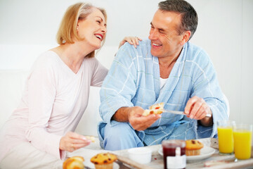 Mature couple, bedroom and food for wellness, breakfast and nutrition for retirement health. senior woman, man and croissant or muffin with fruit jam for diet, romance and elderly care or support