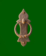 Ancient door knocker dating back to the 19th century. Copyspace around.