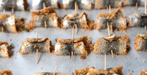 Baked rolled sardines with pine nut dressing, breadcrumbs, raisins, salt and pepper. Typical Sicilian cuisine. Good fish food.