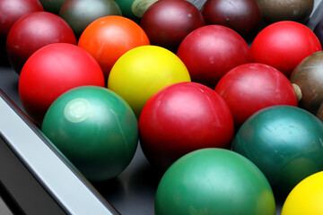 playing sport of bowling and throwing balls for entertainment. Ball alley strike concept. bowling with many colorful balls. Many colorful balls for entertainment during sport of lifestyle bowling 