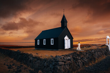 Fototapeta premium the famous church on the west iceland view with magical sunset