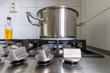 stainless steel cooking pot on gas stove