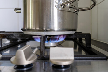 stainless steel cooking pot on gas stove