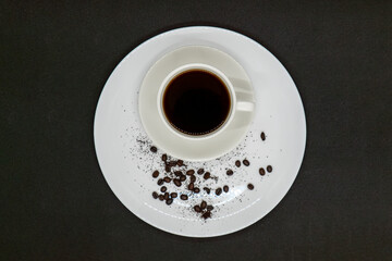 Espresso Americano in a ceramic fancy cup with fresh coffee bean scattered Isolated White Background