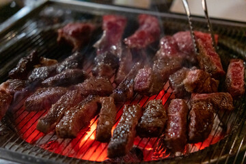Hanwoo Beef, Korean Style Meat on the Grill. BBQ rare meat with soft focus