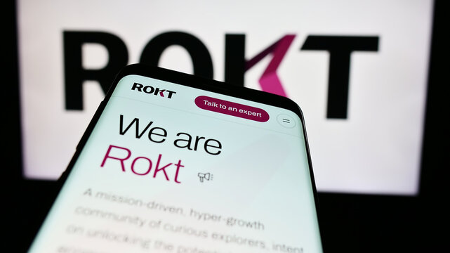 Stuttgart, Germany - 07-14-2024: Smartphone with website of e-commerce technology company Rokt Pte. Ltd. in front of business logo. Focus on top-left of phone display.