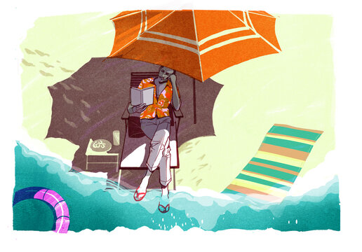 Man on a beach reading as the tide comes in 