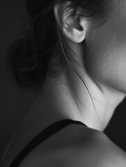 Close-up portrait of a woman's face in black and white, suitable for editorial or artistic use