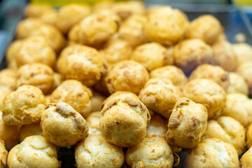 Delicious handmade puffs of the day are displayed on the counter