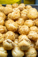Delicious handmade puffs of the day are displayed on the counter