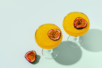 Cocktail spritz with passion fruit on blue background