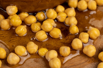 chickpeas porridge with honey during cooking