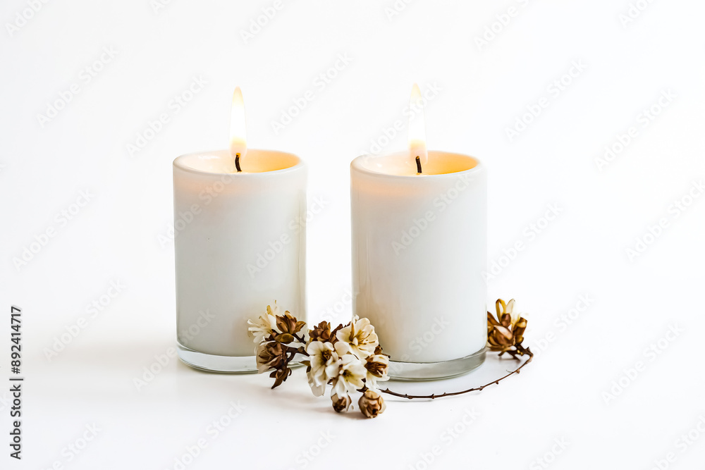 Canvas Prints Two White Candles Burning with Flowers