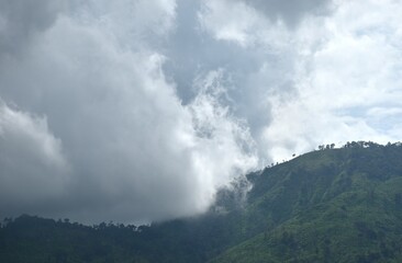 landscape of mountain with rain cloud and mist at Sai Thong water reservoir lake in Thailand