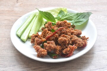 deep fried spicy mashed pork salad eat couple with fresh vegetable on plate