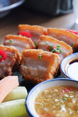 Thai crispy pork belly with Thai seafood sauce and sweet soy sauce