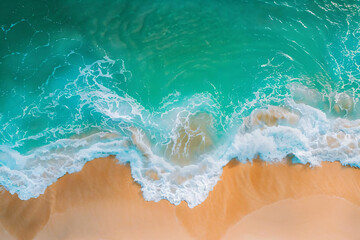 Aerial View of Turquoise Ocean Waves Crashing on Sandy Beach.
