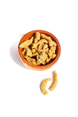 Fried chicken intestines Indonesian food is called usus goreng in a small wooden bowl isolated on white background