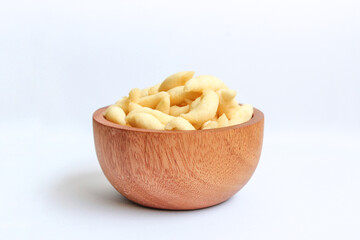 Crunchy Cheese Stick or Cheese Cork Eggs or Telur Gabus Keju or Widaran or Bidaran Keju on small wooden bowl isolated on white background