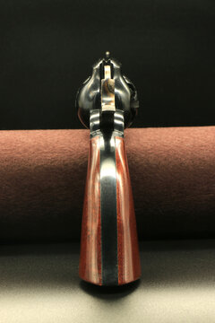 Black powder revolver 1858 New Army on a black background. Rear view, point of vision.