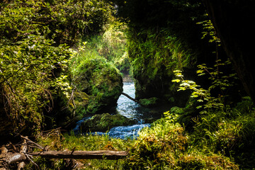 Beautiful Korana river waterfalls overgrown in vegetation at the village of Rastoke, Croatia