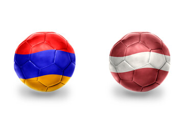 Fototapeta premium football balls with national flags of latvia and armenia , soccer teams. on the white background.